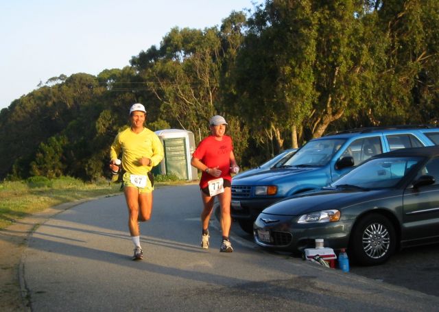 Runners coming around the lake